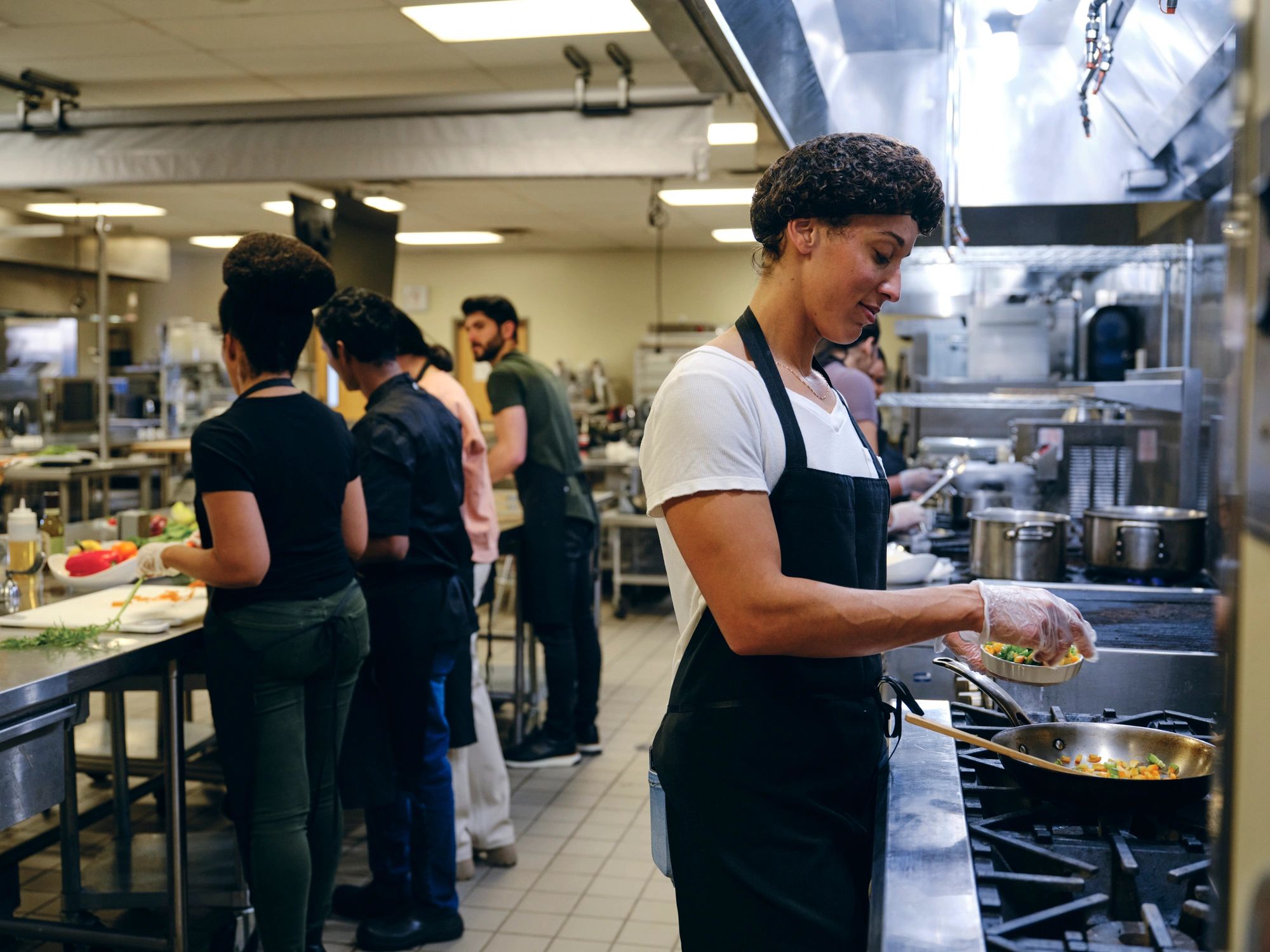 Staff working in a commercial kitchen