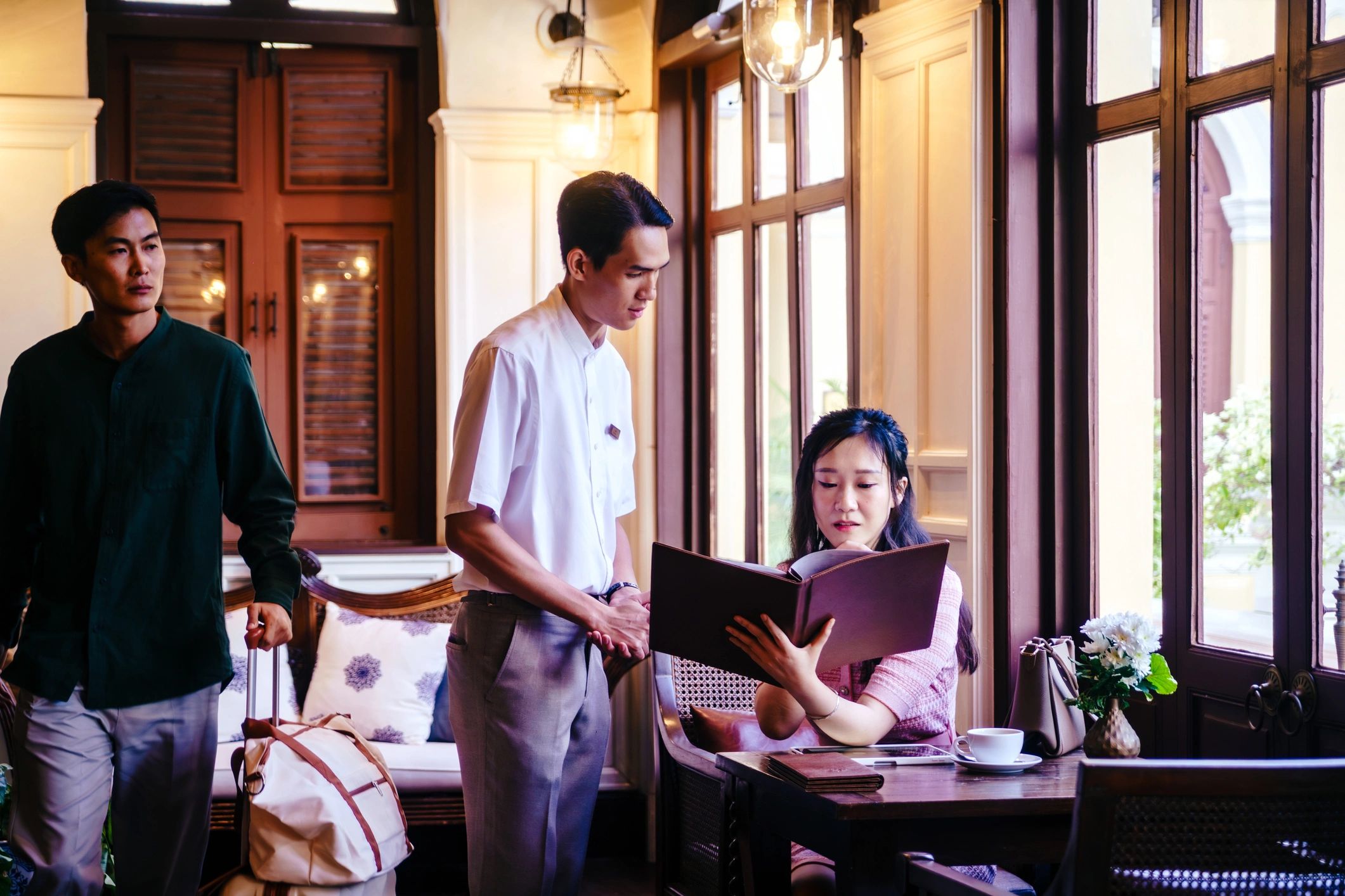 Staff member taking an order at a hotel restaurant
