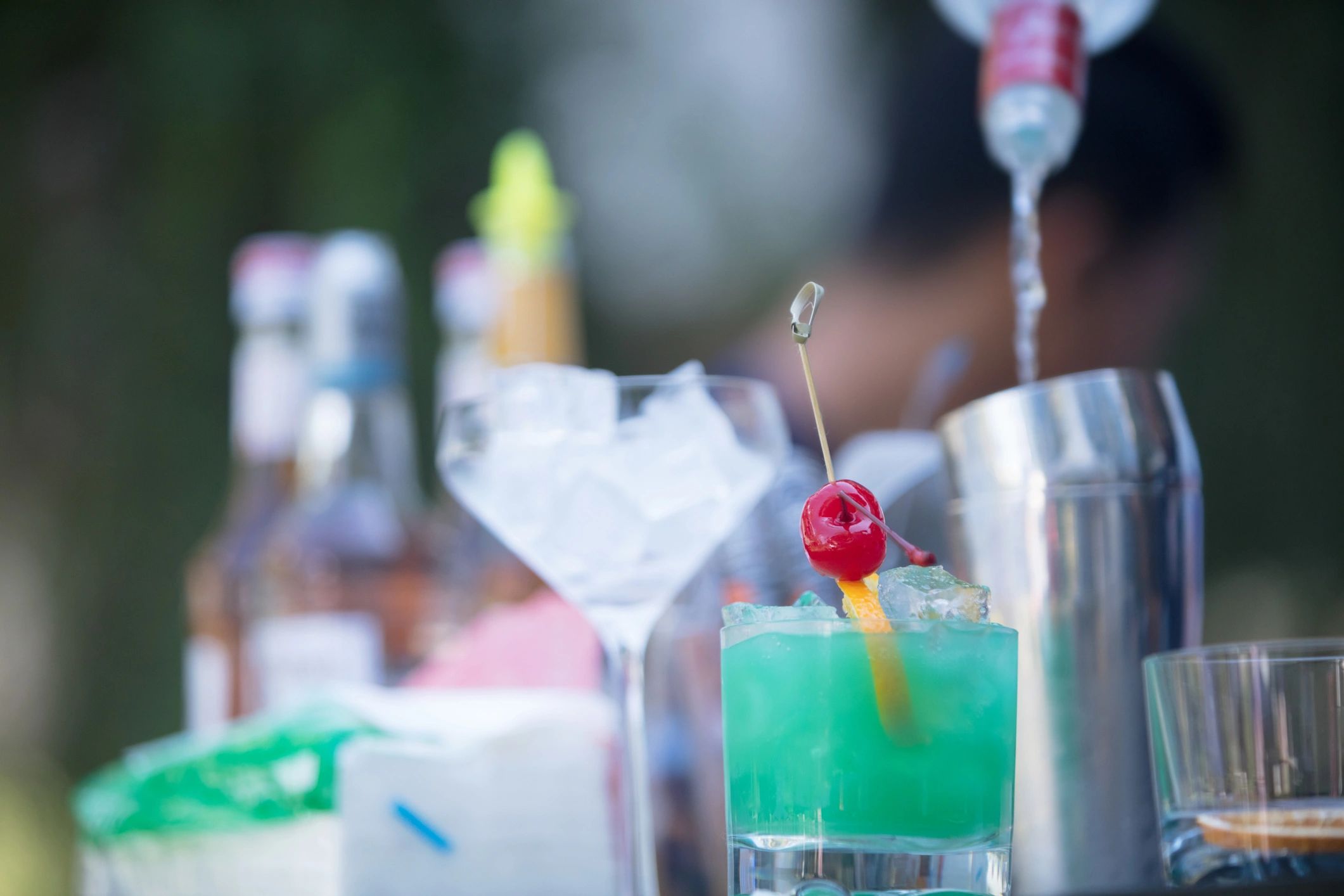 Cocktail being poured into a glass